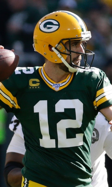 Rodgers has 5 TD passes, 1 rushing score as Packers roll